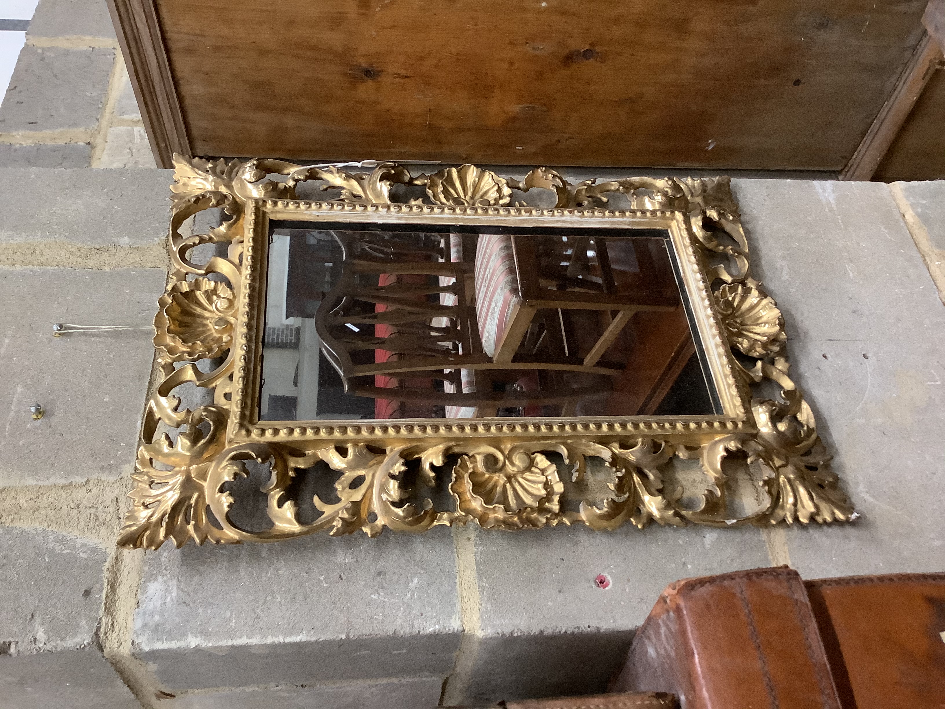 A Venetian foliate carved and pierced giltwood wall mirror, width 36cm, height 50cm 51.5 x 36.5cm